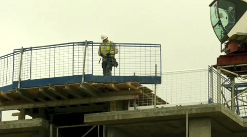 Construction site worker on top of platform Stock Footage 56436116