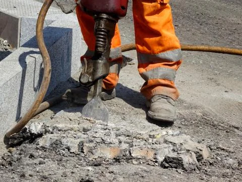 Construction Site Worker Using A Pneumatic Drill Stock Photos