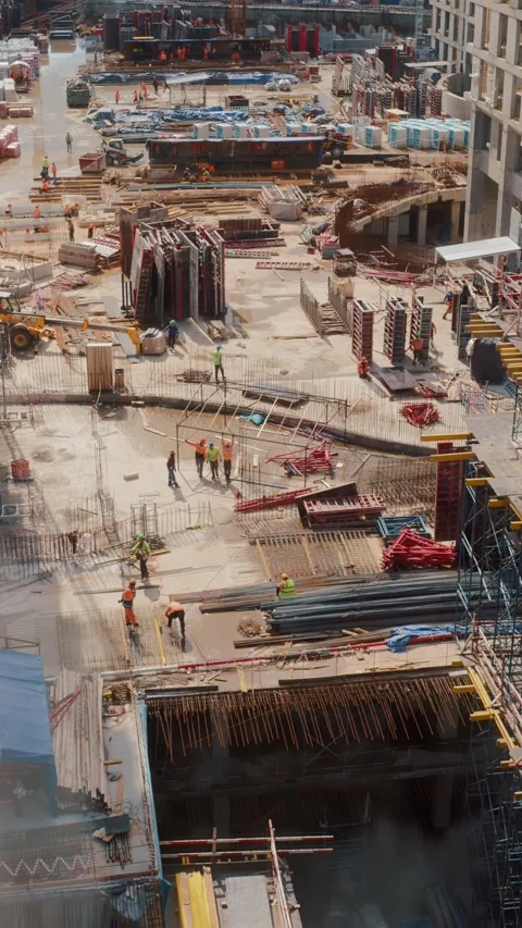 Construction site with workers and equipment at foundation stage of modern Vídeos de archivo 318087947