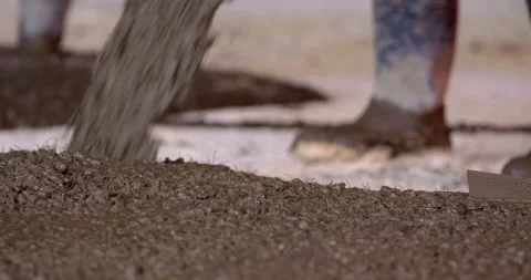 On a construction site, workers from an automatic mixer pour concrete  Stock Footage 147637085
