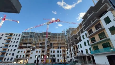 Construction site workers building modern residential complex Video stock 326092484