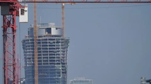 Construction site workers   building new apartments. silhouette crane working Video stock 57369580