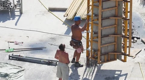 Construction site workers   building new apartments. silhouette crane working Video stock 57376770