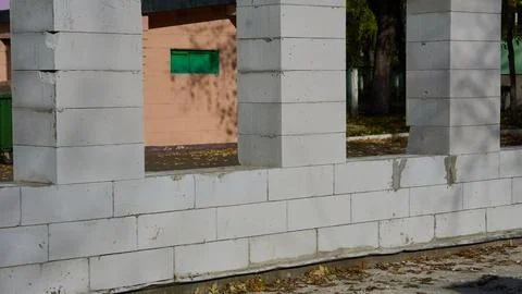 Construction site.House wall under construction with window openings Stock Photos
