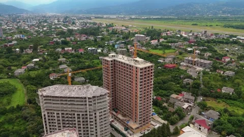 Construction sites against the backdrop of green hills aerial view Stock Footage 300280147