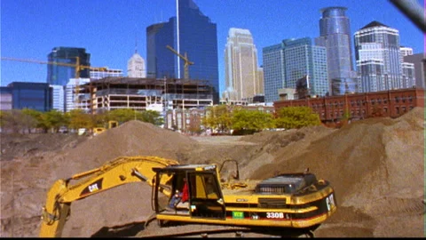 Construction sites downtown -machine digs sand timelapse Video stock 145784093