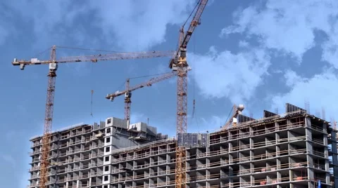 Construction skyscraper tower cranes in the clouds time lapse Stock Footage 64634475
