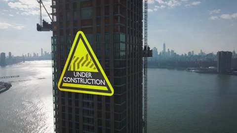 Construction Skyscraper Under Development with Digital Warning Sign 库存影片 331045798