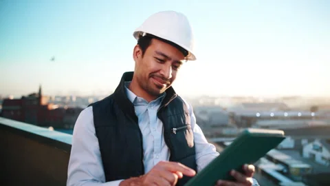 Construction, smile and tablet with architect on rooftop for city planning or Stock Footage 337926314