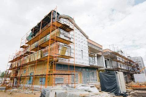 Construction of a social facility of a school or kindergarten in a modern sty Stock Photos