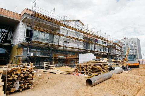 Construction of a social facility of a school or kindergarten in a modern sty Stock Photos