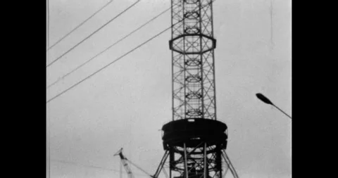 Construction of a Soviet radio or TV tower in the USSR, 1970s. Retro Stock Footage 331853195