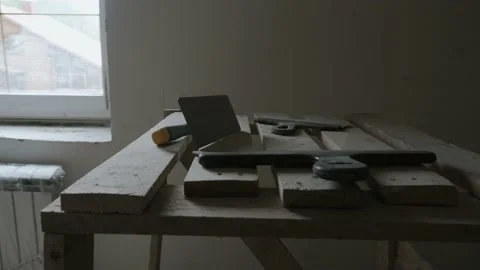 Construction spatulas lie on the scaffolding. Stock Footage 139917399