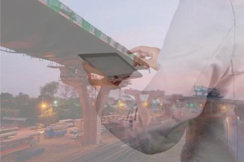 Construction specialist using a tablet computer. At a construction site. Foto stock