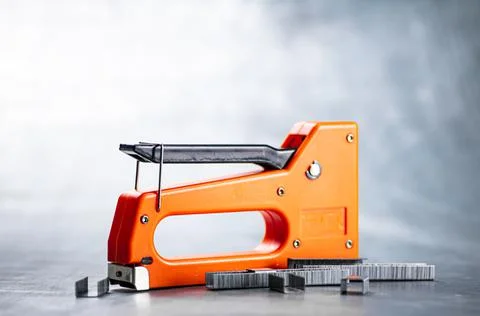 Construction stapler on the table. Stock Photos