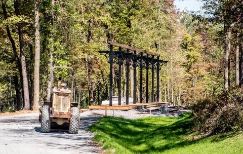 Construction of a Structure Near a Road Surrounded by Trees in Autumn Stock Photos