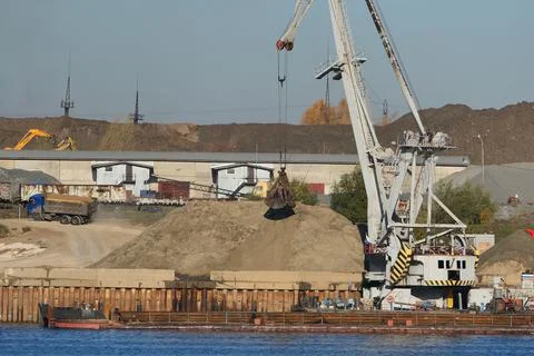 Construction structures on the banks of the river. Stock Photos