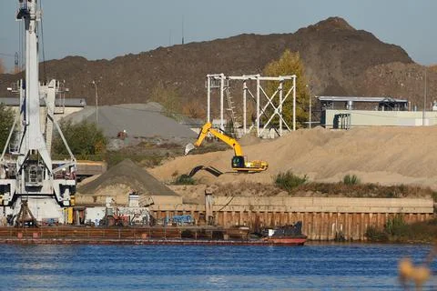 Construction structures on the banks of the river. Stock Photos