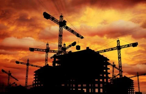 Construction sunset theme. construction cranes and building silhouette. Stock Illustration