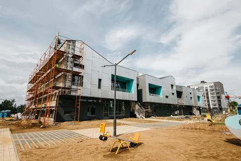 Construction of a super modern, stylish school in a residential neighborhood Stock Photos