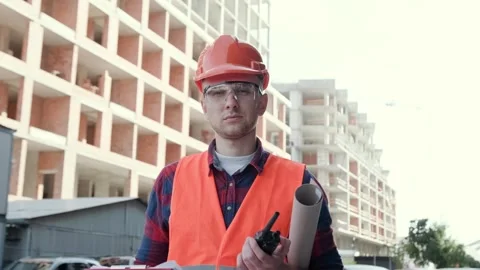 Construction superintendent posing for camera during development site inspection Stock Footage 274404972
