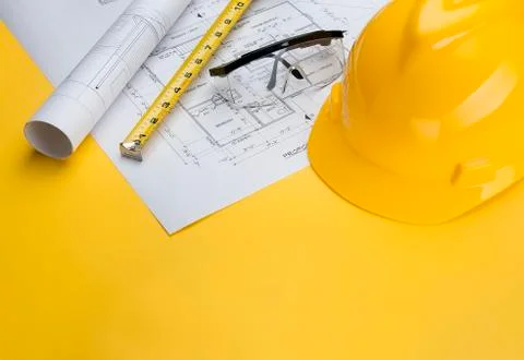 Construction Supervisor Building tools with Blueprints Stock Photos