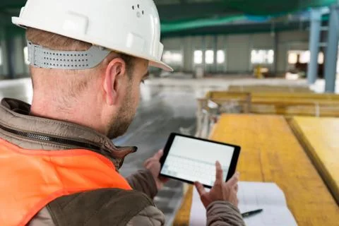 Construction supervisor with digital tablet on site Stock Photos