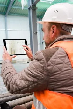 Construction supervisor with digital tablet on site Stock Photos
