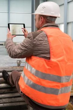 Construction supervisor with digital tablet on site Stock Photos