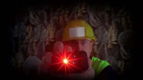 Construction supervisor measuring with laser tool Stock Photos