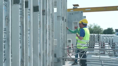 Construction supervisor monitors progress and supervises Stock Footage 255349369