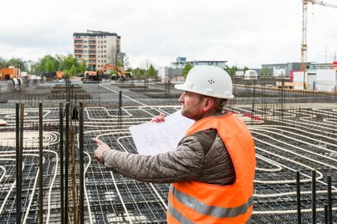 Construction supervisor with plan on site Stock Photos