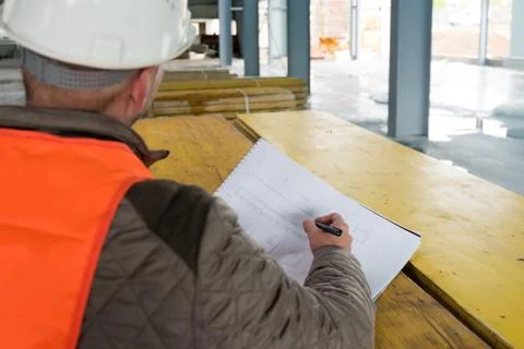 Construction supervisor with plan on site Stock Photos