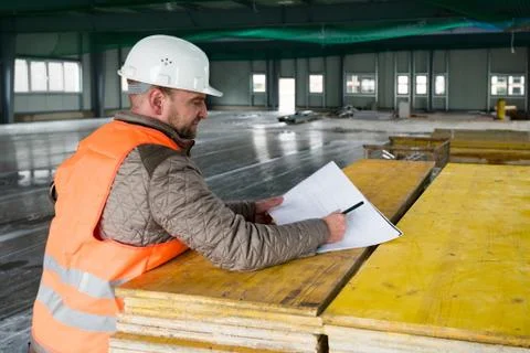 Construction supervisor with plan on site Stock Photos