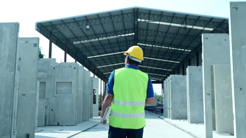 Construction supervisor walks to inspect work, Video stock 255351802