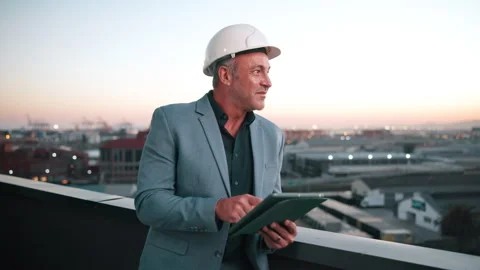 Construction, tablet and thinking with architect on rooftop for city expansion Stock Footage 337923893