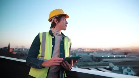 Construction, tablet and thinking with man on rooftop for city planning or Stock Footage 337925150