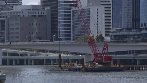 Construction taking place over the city scape with the river Stock Footage 160448207