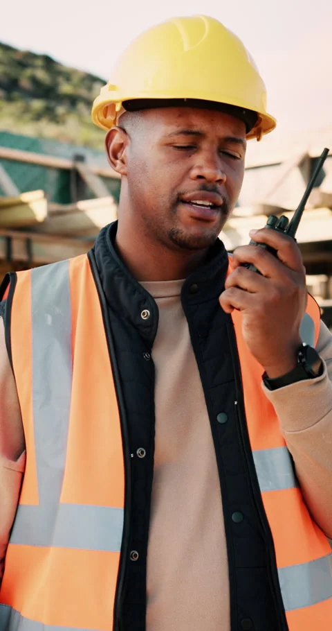 Construction, talking and black man with radio at site for communication Stock Footage 336244077