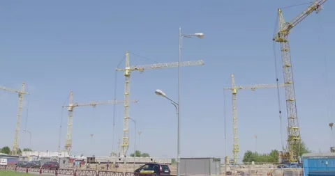 Construction tall cranes on a background of blue sky. Video stock 132267736