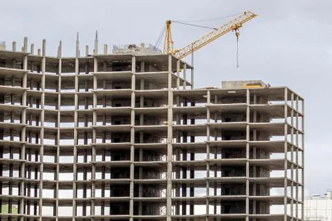 The construction of a tall frame building. Stock Photos