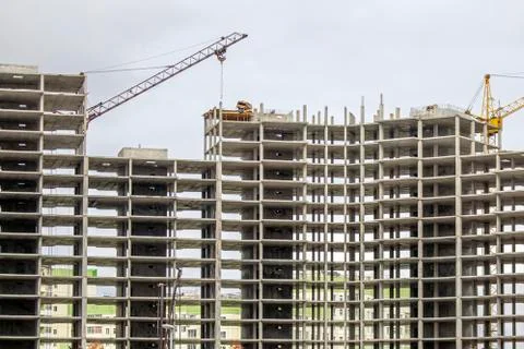The construction of a tall frame building. Stock Photos