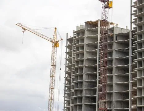 The construction of a tall frame building. Stock Photos