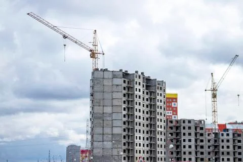 The construction of a tall frame building. Stock Photos