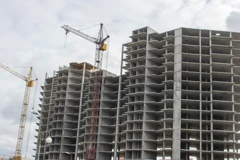 The construction of a tall frame building. Stock Photos