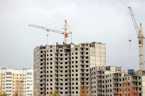 The construction of a tall frame building. Stock Photos