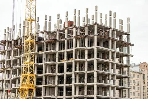 The construction of a tall frame building. Stock Photos