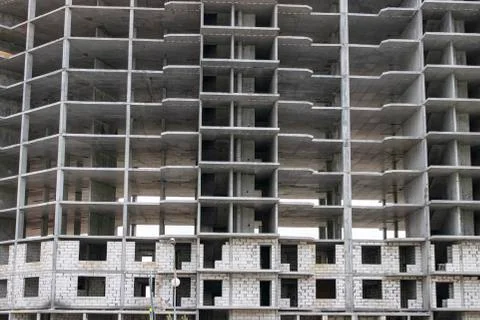 The construction of a tall frame building. Stock Photos