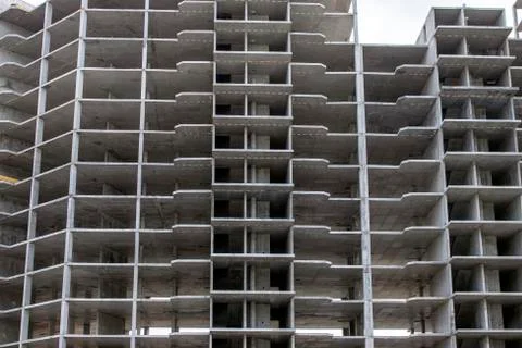 The construction of a tall frame building. Stock Photos