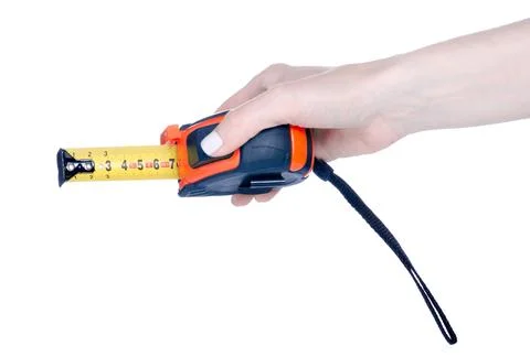 Construction tape measure in hand Stock Photos